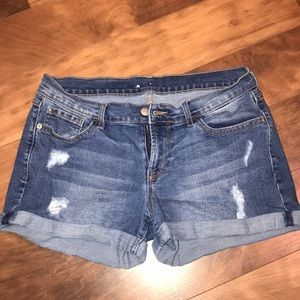 Distressed blue jean shorts